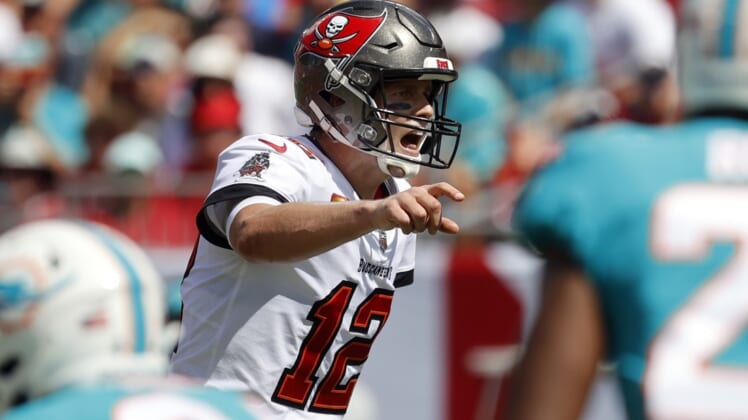 Oct 10, 2021; Tampa, Florida, USA; Tampa Bay Buccaneers quarterback Tom Brady (12) throws the ball against the Miami Dolphins during the first half at Raymond James Stadium. Mandatory Credit: Kim Klement-USA TODAY Sports