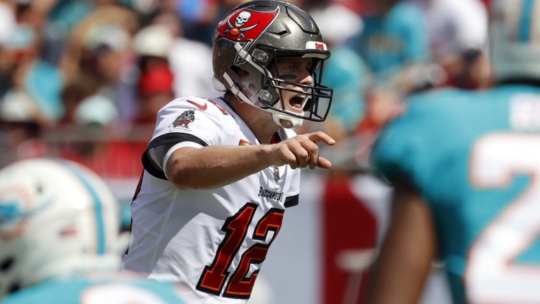 Oct 10, 2021; Tampa, Florida, USA; Tampa Bay Buccaneers quarterback Tom Brady (12) throws the ball against the Miami Dolphins during the first half at Raymond James Stadium. Mandatory Credit: Kim Klement-USA TODAY Sports