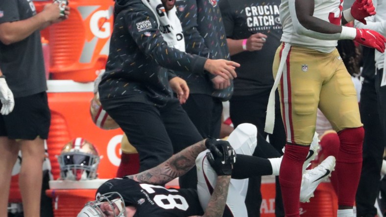 Oct 10, 2021; Glendale, Arizona, USA; Arizona Cardinals tight end Maxx Williams (87) grabs his knee after a catch and run against the San Francisco 49ers during the second quarter at State Farm Stadium. He was taken off the field on a cart. Mandatory Credit: Michael Chow-USA TODAY Sports