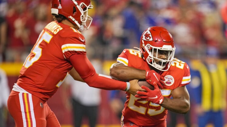 Kansas City Chiefs quarterback Patrick Mahomes (15) hands off to