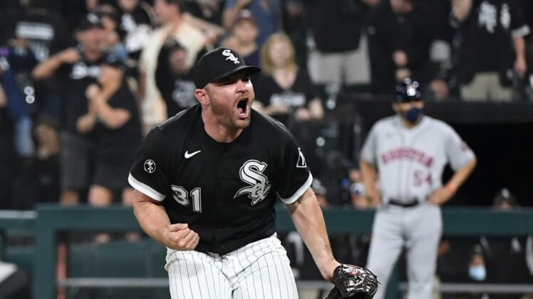 Oct 10, 2021; Chicago, Illinois, USA; Chicago White Sox relief pitcher Liam Hendriks (31) reacts after striking out Houston Astros second baseman Jose Altuve (not pictured) for the final out of the game during game three of the 2021 ALDS at Guaranteed Rate Field. Mandatory Credit: Matt Marton-USA TODAY Sports