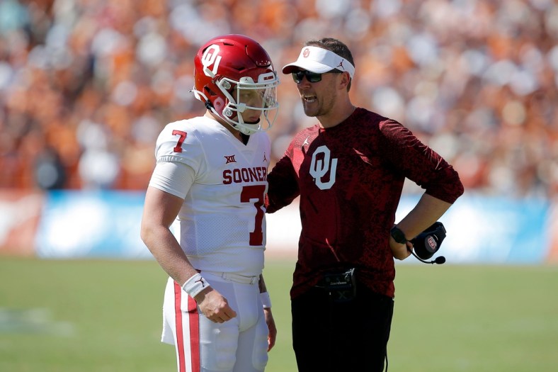 Oklahoma coach Lincoln Riley talks with Oklahoma's Spencer Rattler (7) before a two point-conversion attempt during the Red River Showdown college football game between the University of Oklahoma Sooners (OU) and the University of Texas (UT) Longhorns at the Cotton Bowl in Dallas, Saturday, Oct. 9, 2021.  Oklahoma won 55-48.

Ou Vs Texas