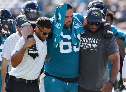 Jacksonville Jaguars center Brandon Linder (65) is assisted to a cart after he was injured during a fourth quarter play. The Jacksonville Jaguars hosted the Tennessee Titans at TIAA Bank Field in Jacksonville, Florida, October 10, 2021.  The Jaguars trailed at the half 24 to 13 and lost with a final score of 37-19. [Bob Self/Florida Times-Union]

Jki 101021 Jaguarsvstitans 35