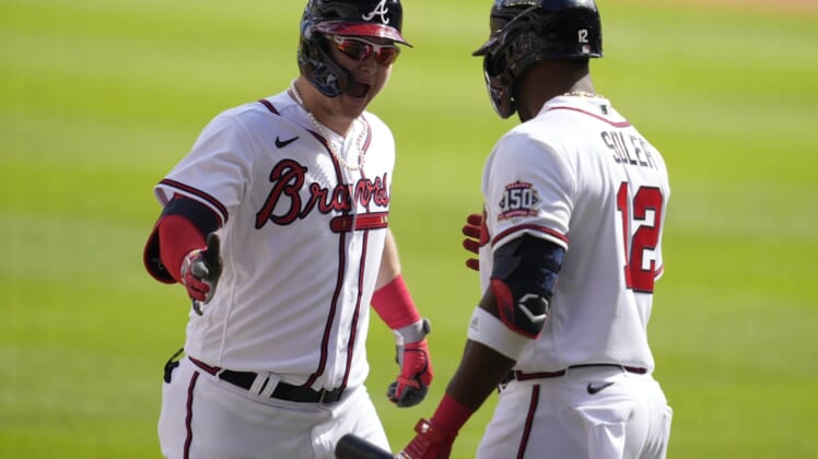 Oct 11, 2021; Cumberland, GA, USA; Atlanta Braves left fielder Joc Pederson (22) celebrates with right fielder Jorge Soler (12) after hitting a three-run home run against the Milwaukee Brewers during the fifth inning during game three of the 2021 ALDS at Truist Park. Mandatory Credit: Dale Zanine-USA TODAY Sports