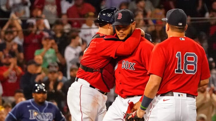 Oct 11, 2021; Boston, Massachusetts, USA; Boston Red Sox catcher Christian Vazquez (7) hugs starting pitcher Eduardo Rodriguez (57) during the sixth inning against the Tampa Bay Rays during game four of the 2021 ALDS at Fenway Park. Mandatory Credit: David Butler II-USA TODAY Sports