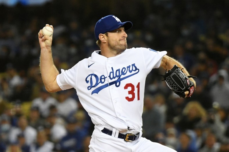 Oct 11, 2021; Los Angeles, California, USA; Los Angeles Dodgers starting pitcher Max Scherzer (31) pitches against the San Francisco Giants in the first inning during game three of the 2021 NLDS at Dodger Stadium. Mandatory Credit: Richard Mackson-USA TODAY Sports