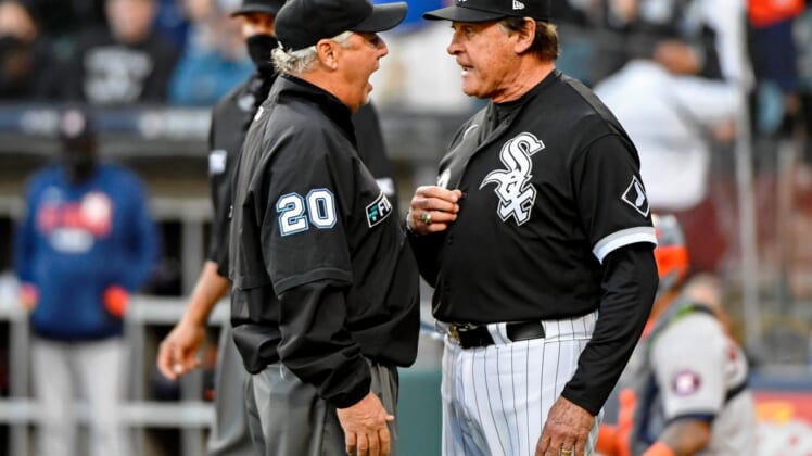 Oct 12, 2021; Chicago, Illinois, USA; Right field umpire Tom Hallion (20) talks to Chicago White Sox manager Tony La Russa (22) after first baseman Jose Abreu (not pictured) was hit by a pitch against the Houston Astros during the eighth inning in game four of the 2021 ALDS at Guaranteed Rate Field. Mandatory Credit: Matt Marton-USA TODAY Sports