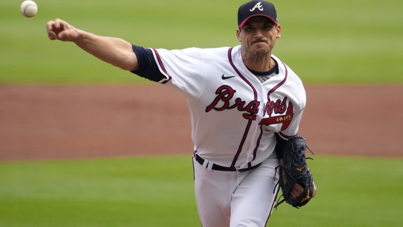 Oct 12, 2021; Cumberland, Georgia, USA; Atlanta Braves starting pitcher Charlie Morton (50) throws a pitch against the Milwaukee Brewers in the first inning during game four of the 2021 ALDS at Truist Park. Mandatory Credit: Dale Zanine-USA TODAY Sports