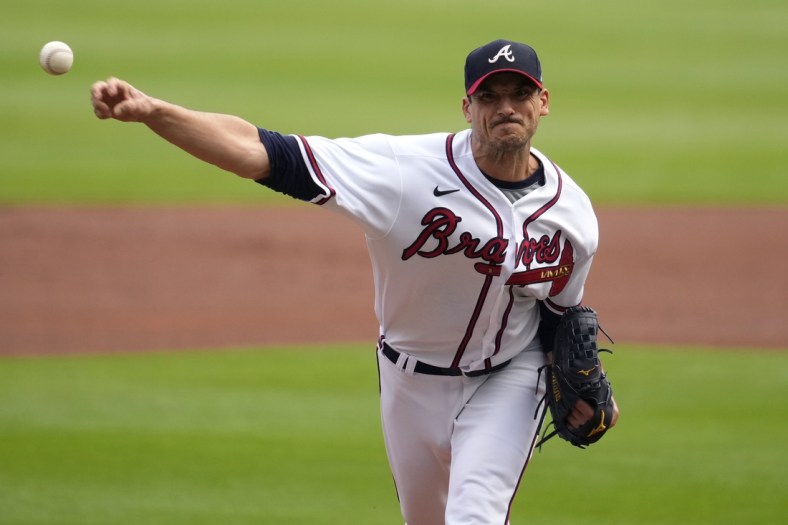 Oct 12, 2021; Cumberland, Georgia, USA; Atlanta Braves starting pitcher Charlie Morton (50) throws a pitch against the Milwaukee Brewers in the first inning during game four of the 2021 ALDS at Truist Park. Mandatory Credit: Dale Zanine-USA TODAY Sports