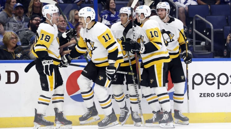 Oct 12, 2021; Tampa, Florida, USA; Pittsburgh Penguins center Brian Boyle (11) celebrates with teammates after scoring a goal against the Tampa Bay Lightning during the second period at Amalie Arena. Mandatory Credit: Kim Klement-USA TODAY Sports