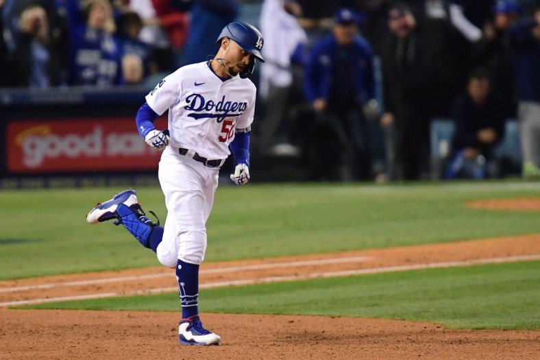 Oct 12, 2021; Los Angeles, California, USA; Los Angeles Dodgers right fielder Mookie Betts (50) rounds the bases after hitting a two-run home run during the fourth inning against the San Francisco Giants in game four of the 2021 NLDS at Dodger Stadium. Mandatory Credit: Gary A. Vasquez-USA TODAY Sports