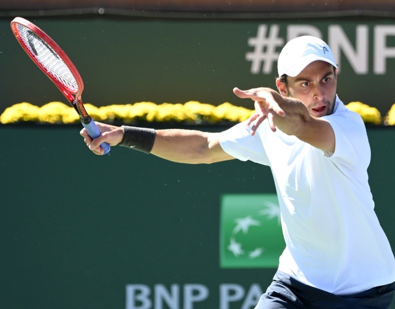 Oct 13, 2021; Indian Wells, CA, USA; Aslan Karatsev (RUS) gets set to hit a shot during his fourth round match against Hubert Hurkacz (POL) during the BNP Paribas Open at the Indian Wells Tennis Garden. Mandatory Credit: Jayne Kamin-Oncea-USA TODAY Sports