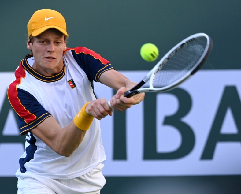 Oct 13, 2021; Indian Wells, CA, USA; Jannik Sinner (ITA) hits a shot against Taylor Fritz (USA) in their fourth round match during the BNP Paribas Open at the Indian Wells Tennis Garden. Mandatory Credit: Jayne Kamin-Oncea-USA TODAY Sports
