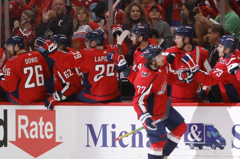 Oct 13, 2021; Washington, District of Columbia, USA; Washington Capitals right wing T.J. Oshie (77) celebrates with teammates after scoring a goal against the New York Rangers during the first period at Capital One Arena. Mandatory Credit: Geoff Burke-USA TODAY Sports