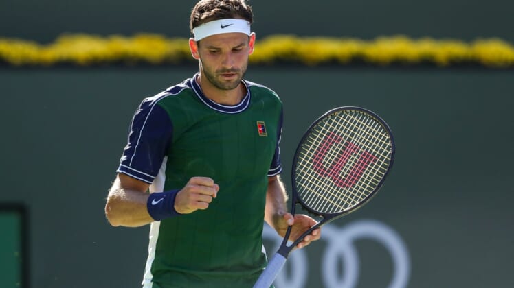 Grigor Dimitrov of Bulgaria celebrates a point against Daniil Medvedev of Russia during their round four match of the BNP Paribas Open, Wednesday, Oct. 13, 2021, in Indian Wells, Calif.