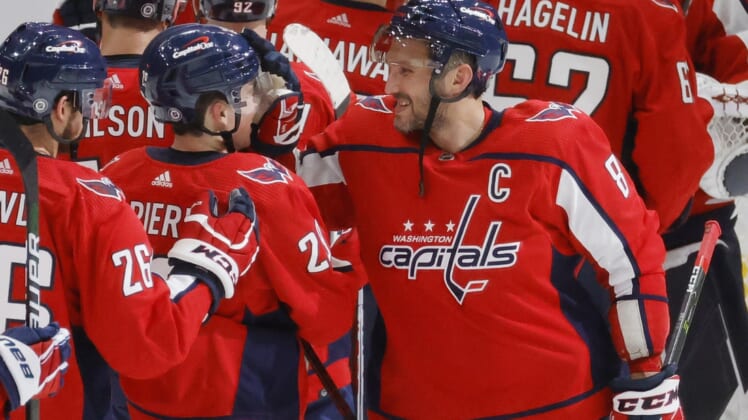 Oct 13, 2021; Washington, District of Columbia, USA; Washington Capitals left wing Alex Ovechkin (8) celebrates with Capitals center Hendrix Lapierre (29) after their game against the New York Rangers at Capital One Arena. Mandatory Credit: Geoff Burke-USA TODAY Sports