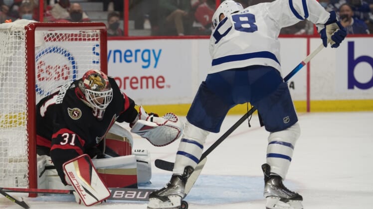 Oct 14, 2021; Ottawa, Ontario, CAN; Ottawa Senators goalie Anton Forsberg (31) makes a save on a shot from Toronto Maple Leafs left wing Micheal Bunting (58) in the first period at the Canadian Tire Centre. Mandatory Credit: Marc DesRosiers-USA TODAY Sports
