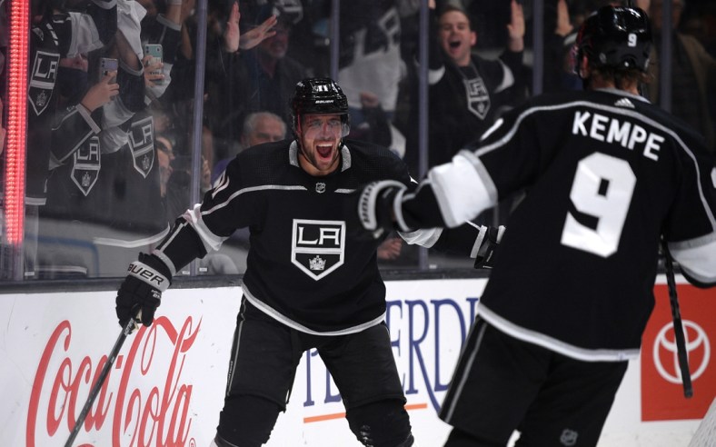 Oct 14, 2021; Los Angeles, California, USA; Los Angeles Kings center Anze Kopitar (11) celebrates with right wing Adrian Kempe (9) after scoring a goal during the second period against the Vegas Golden Knights at Staples Center. Mandatory Credit: Orlando Ramirez-USA TODAY Sports