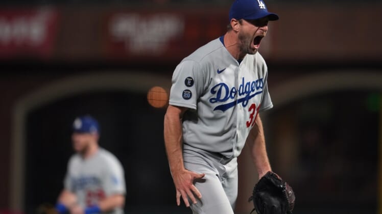 Oct 14, 2021; San Francisco, California, USA; Los Angeles Dodgers starting pitcher Max Scherzer (31) reacts after defeating the San Francisco Giants in game five of the 2021 NLDS at Oracle Park. Mandatory Credit: Neville E. Guard-USA TODAY Sports