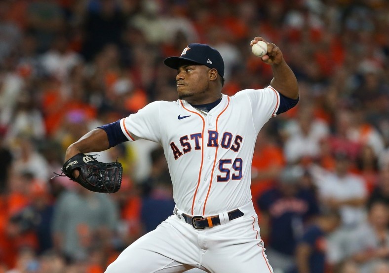 Oct 15, 2021; Houston, Texas, USA; Houston Astros starting pitcher Framber Valdez (59) pitches against the Boston Red Sox during the first inning in game one of the 2021 ALCS at Minute Maid Park. Mandatory Credit: Thomas Shea-USA TODAY Sports
