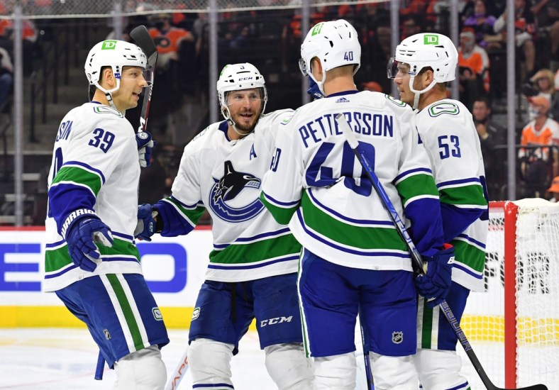 Oct 15, 2021; Philadelphia, Pennsylvania, USA; Vancouver Canucks center Elias Pettersson (40) celebrates his goal with teammates against the Philadelphia Flyers during the second period at Wells Fargo Center. Mandatory Credit: Eric Hartline-USA TODAY Sports