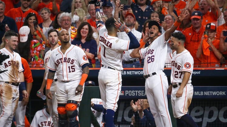 Oct 15, 2021; Houston, Texas, USA; Houston Astros shortstop Carlos Correa (1) celebrates with Jose Siri (26) after hitting a go-ahead solo home run against the Boston Red Sox during the seventh inning in game one of the 2021 ALCS at Minute Maid Park. Mandatory Credit: Troy Taormina-USA TODAY Sports