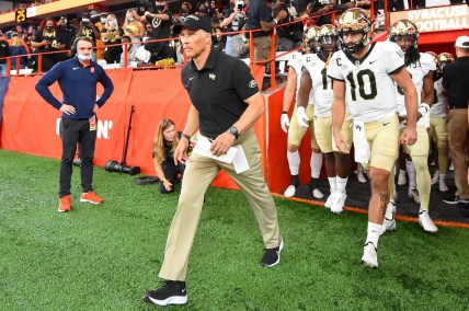 Oct 9, 2021; Syracuse, New York, USA; Wake Forest Demon Deacons head coach Dave Clawson leads his team on the field prior to the game against the Syracuse Orange at the Carrier Dome. Mandatory Credit: Rich Barnes-USA TODAY Sports