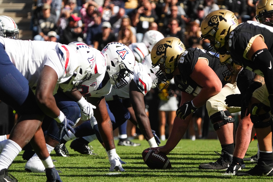 Oct 16, 2021; Boulder, Colorado, USA; Members of the Arizona Wildcats line up across from the Colorado Buffaloes in the first quarter at Folsom Field. Mandatory Credit: Ron Chenoy-USA TODAY Sports