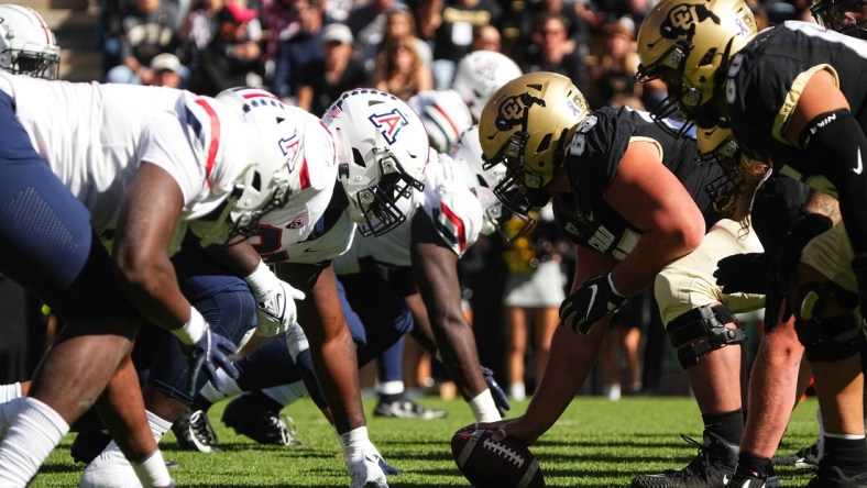 Oct 16, 2021; Boulder, Colorado, USA; Members of the Arizona Wildcats line up across from the Colorado Buffaloes in the first quarter at Folsom Field. Mandatory Credit: Ron Chenoy-USA TODAY Sports