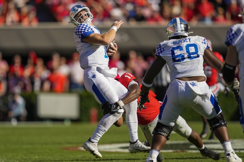 Oct 16, 2021; Athens, Georgia, USA; Kentucky Wildcats quarterback Will Levis (7) is tackled by Georgia Bulldogs linebacker Nakobe Dean (17) during the first half at Sanford Stadium. Mandatory Credit: Dale Zanine-USA TODAY Sports