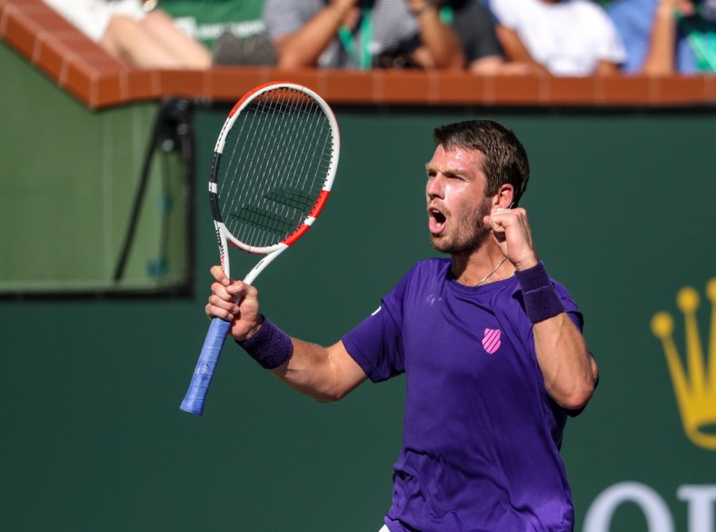 Cameron Norrie of Great Britain celebrates winning his semifinal match against Grigor Dimitrov of Bulgaria during the BNP Paribas Open at the Indian Wells Tennis Garden, Saturday, Oct. 16, 2021, in Indian Wells, Calif.