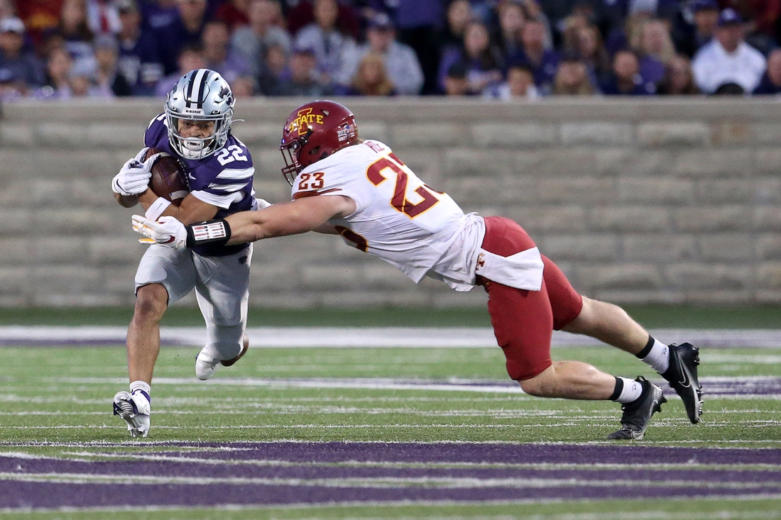 Oct 16, 2021; Manhattan, Kansas, USA; Kansas State Wildcats running back Deuce Vaughn (22) runs against Iowa State Cyclones linebacker Mike Rose (23) during the first quarter at Bill Snyder Family Football Stadium. Mandatory Credit: Scott Sewell-USA TODAY Sports