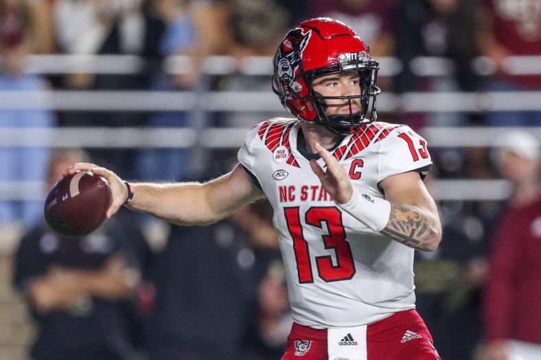 Oct 16, 2021; Chestnut Hill, Massachusetts, USA; North Carolina State Wolfpack quarterback Devin Leary (13) passes the ball during the first half against the Boston College Eagles at Alumni Stadium. Mandatory Credit: Paul Rutherford-USA TODAY Sports