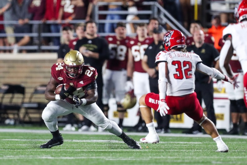 Oct 16, 2021; Chestnut Hill, Massachusetts, USA; Boston College Eagles running back Pat Garwo III (24) runs the ball during the first half against the North Carolina State Wolfpack at Alumni Stadium. Mandatory Credit: Paul Rutherford-USA TODAY Sports