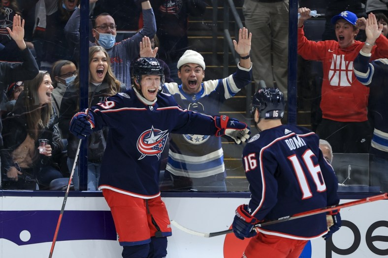 Oct 16, 2021; Columbus, Ohio, USA; Columbus Blue Jackets right wing Patrik Laine (29) celebrates scoring the game winning goal with center Max Domi (16) in the game against the Seattle Kraken in the overtime period at Nationwide Arena. Mandatory Credit: Aaron Doster-USA TODAY Sports