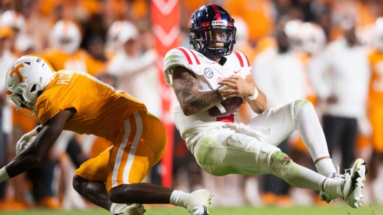 Mississippi quarterback Matt Corral (2) is knocked over by Tennessee defensive back Trevon Flowers (1) during an SEC football game between Tennessee and Ole Miss at Neyland Stadium in Knoxville, Tenn. on Saturday, Oct. 16, 2021.Kns Tennessee Ole Miss Football