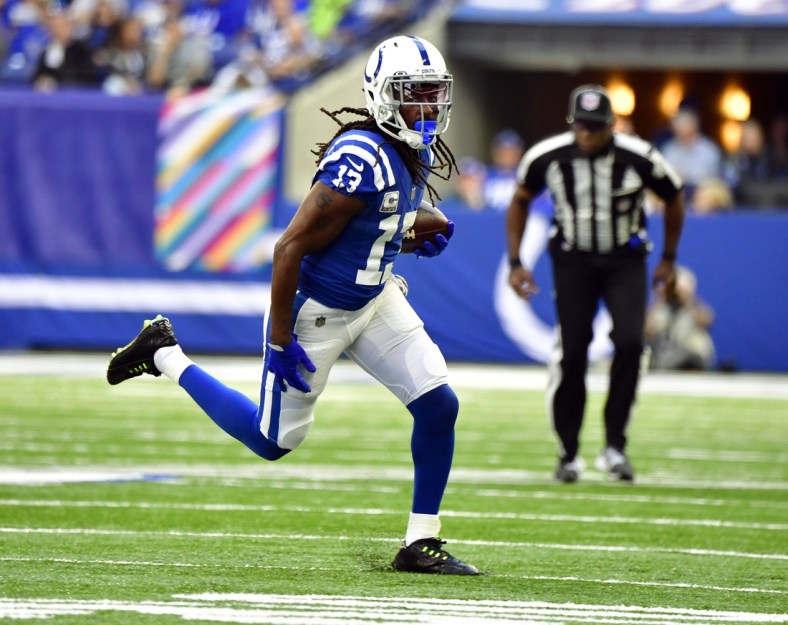 Oct 17, 2021; Indianapolis, Indiana, USA; Indianapolis Colts wide receiver T.Y. Hilton (13) runs the ball during the second half against the Houston Texans at Lucas Oil Stadium. The Colts win 31-3.  Mandatory Credit: Marc Lebryk-USA TODAY Sports