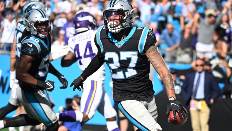 Oct 17, 2021; Charlotte, North Carolina, USA; Carolina Panthers safety Kenny Robinson (27) picks up a block punt and returns it for a toudhdown in the third quarter at Bank of America Stadium. Mandatory Credit: Bob Donnan-USA TODAY Sports