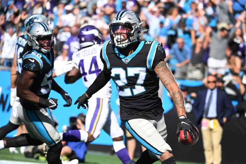 Oct 17, 2021; Charlotte, North Carolina, USA; Carolina Panthers safety Kenny Robinson (27) picks up a block punt and returns it for a toudhdown in the third quarter at Bank of America Stadium. Mandatory Credit: Bob Donnan-USA TODAY Sports