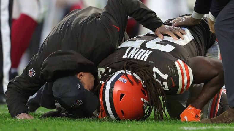 Cleveland Browns running back Kareem Hunt (27) is met by staff members after sustaining an injury during the second half of an NFL football game at FirstEnergy Stadium, Sunday, Oct. 17, 2021, in Cleveland, Ohio. [Jeff Lange/Beacon Journal]

Browns 7