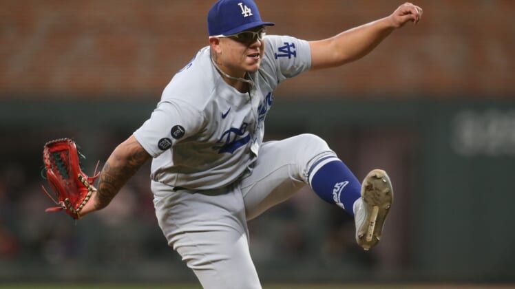 Oct 17, 2021; Cumberland, Georgia, USA; Los Angeles Dodgers starting pitcher Julio Urias (7) pitching  during the eighth inning against the Atlanta Braves in game two of the 2021 NLCS at Truist Park. Mandatory Credit: Brett Davis-USA TODAY Sports