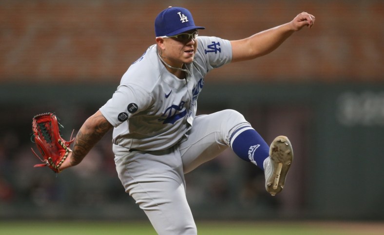 Oct 17, 2021; Cumberland, Georgia, USA; Los Angeles Dodgers starting pitcher Julio Urias (7) pitching  during the eighth inning against the Atlanta Braves in game two of the 2021 NLCS at Truist Park. Mandatory Credit: Brett Davis-USA TODAY Sports