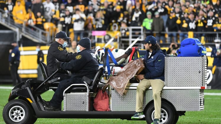 Oct 17, 2021; Pittsburgh, Pennsylvania, USA;  Seattle Seahawks defensive end Darrell Taylor (52) is carted off the field against the Pittsburgh Steelers during the fourth quarter at Heinz Field. The Steelers won 23-20. Mandatory Credit: Philip G. Pavely-USA TODAY Sports