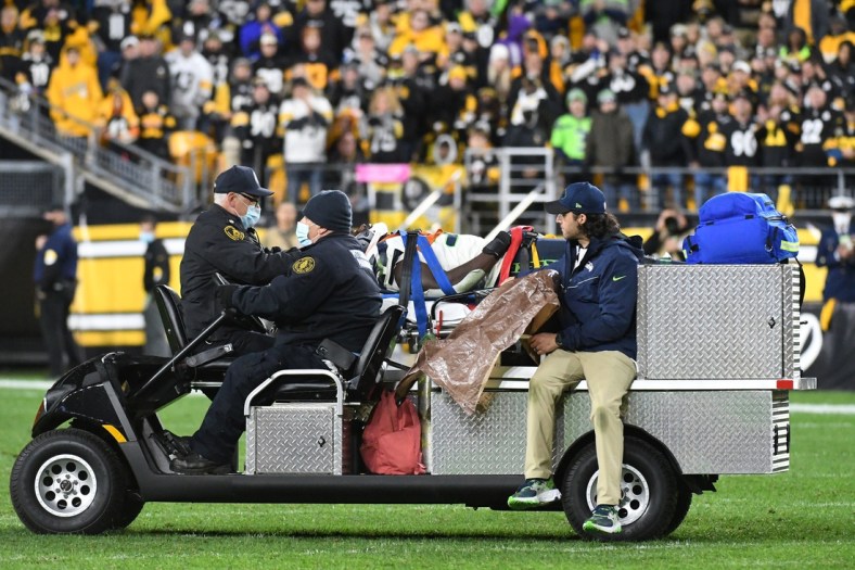 Oct 17, 2021; Pittsburgh, Pennsylvania, USA;  Seattle Seahawks defensive end Darrell Taylor (52) is carted off the field against the Pittsburgh Steelers during the fourth quarter at Heinz Field. The Steelers won 23-20. Mandatory Credit: Philip G. Pavely-USA TODAY Sports