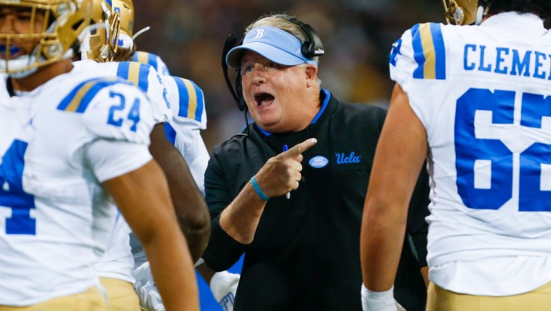 Oct 16, 2021; Seattle, Washington, USA; UCLA Bruins head coach Chip Kelly reacts following a touchdown against the Washington Huskies during the second quarter at Alaska Airlines Field at Husky Stadium. Mandatory Credit: Joe Nicholson-USA TODAY Sports