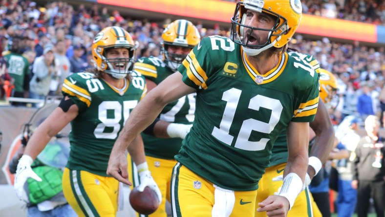 Aaron Rodgers celebrates his rushing touchdown during the fourth quarter against the Chicago Bears.Syndication Usa Today