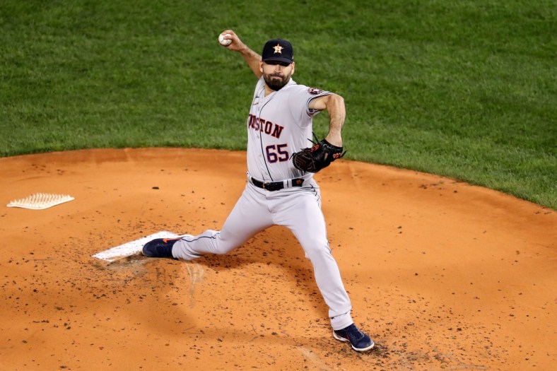 Oct 18, 2021; Boston, Massachusetts, USA; Houston Astros starting pitcher Jose Urquidy (65) pitches against the Boston Red Sox during the second inning of game three of the 2021 ALCS at Fenway Park. Mandatory Credit: Paul Rutherford-USA TODAY Sports
