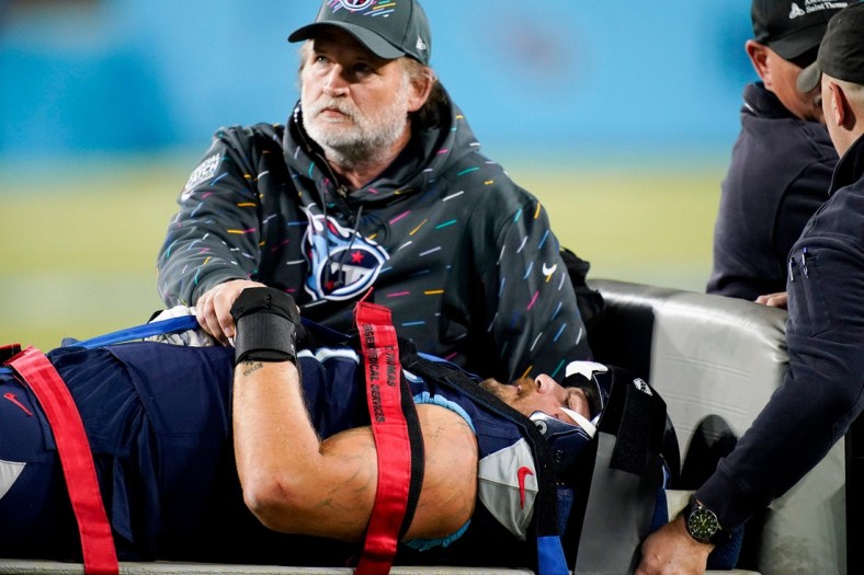 Tennessee Titans offensive tackle Taylor Lewan (77) is taken off the field after was injured at Nissan Stadium Monday, Oct. 18, 2021 in Nashville, Tenn.