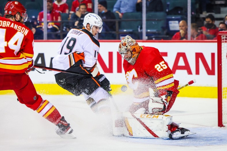 Oct 18, 2021; Calgary, Alberta, CAN; Calgary Flames goaltender Jacob Markstrom (25) makes a save against Anaheim Ducks center Troy Terry (19) during the second period at Scotiabank Saddledome. Mandatory Credit: Sergei Belski-USA TODAY Sports