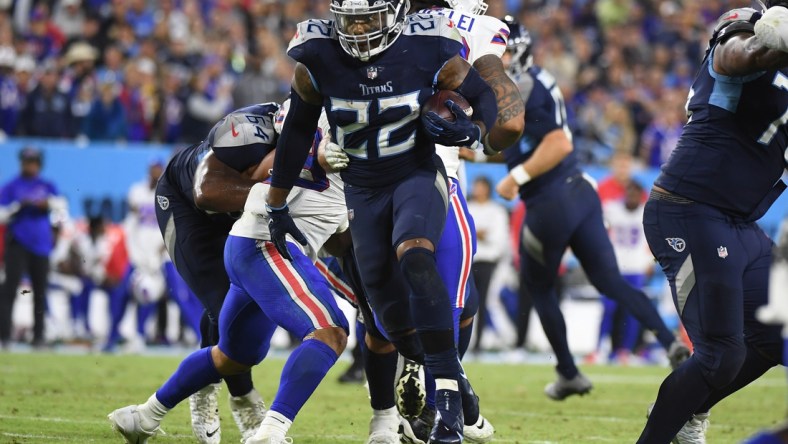 Oct 18, 2021; Nashville, Tennessee, USA; Tennessee Titans running back Derrick Henry (22) runs for a touchdown during the second half against the Buffalo Bills at Nissan Stadium. Mandatory Credit: Christopher Hanewinckel-USA TODAY Sports